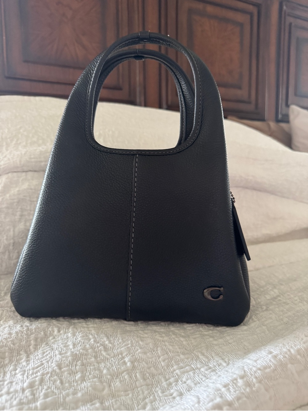 Coach Lana 28 in black leather and black hardware.